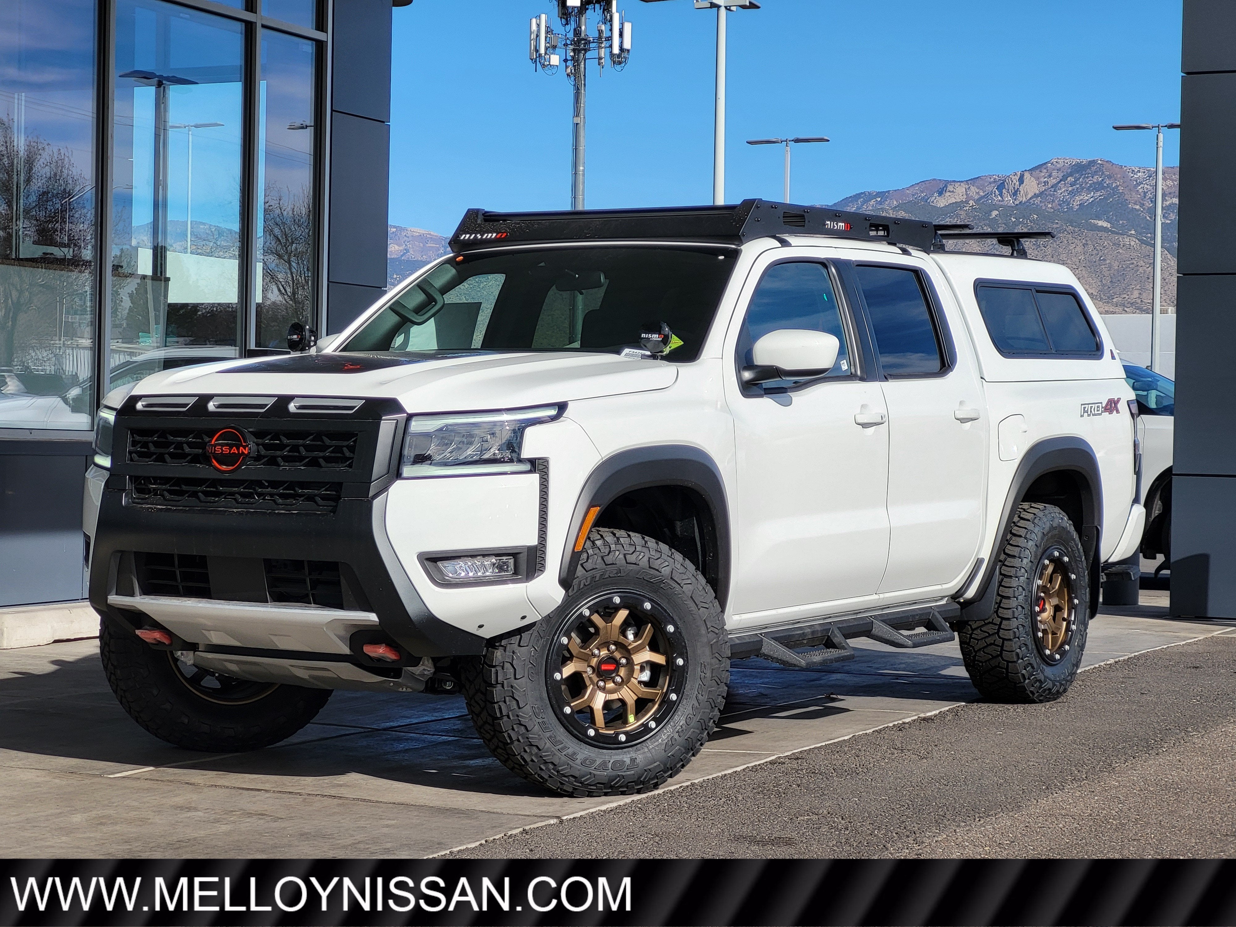 2026 Nissan Frontier Crew Cab 4x4 PRO-4X in Glacier White — front three-quarter view