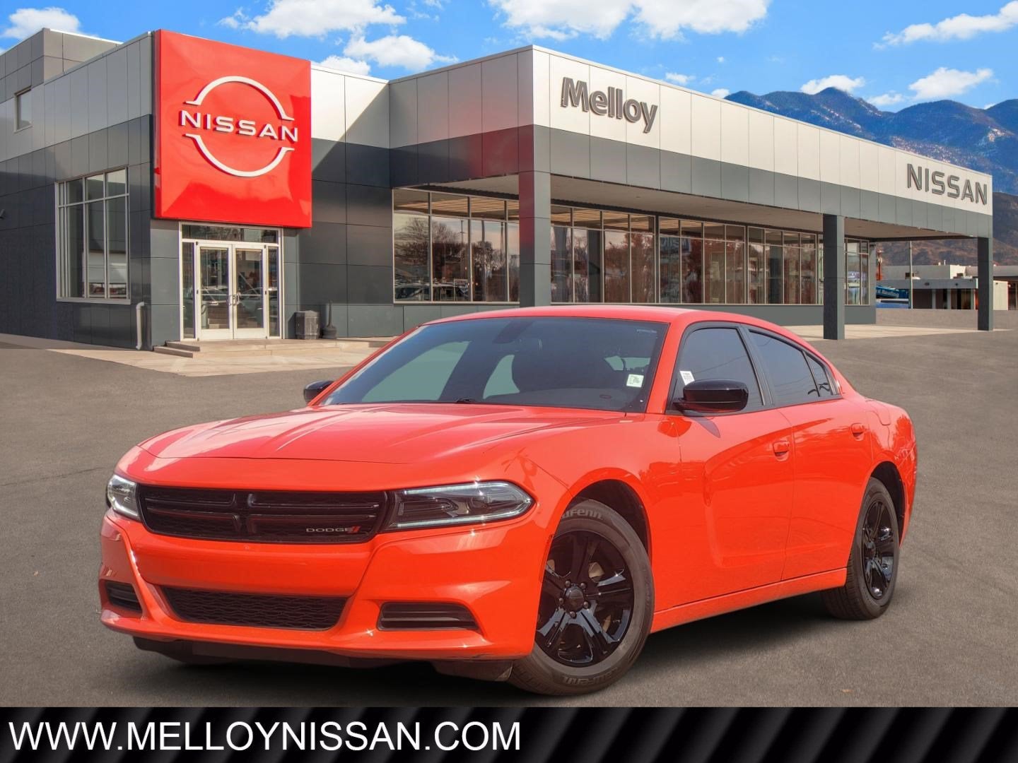2023 Dodge Charger SXT in Go Mango — front three-quarter view
