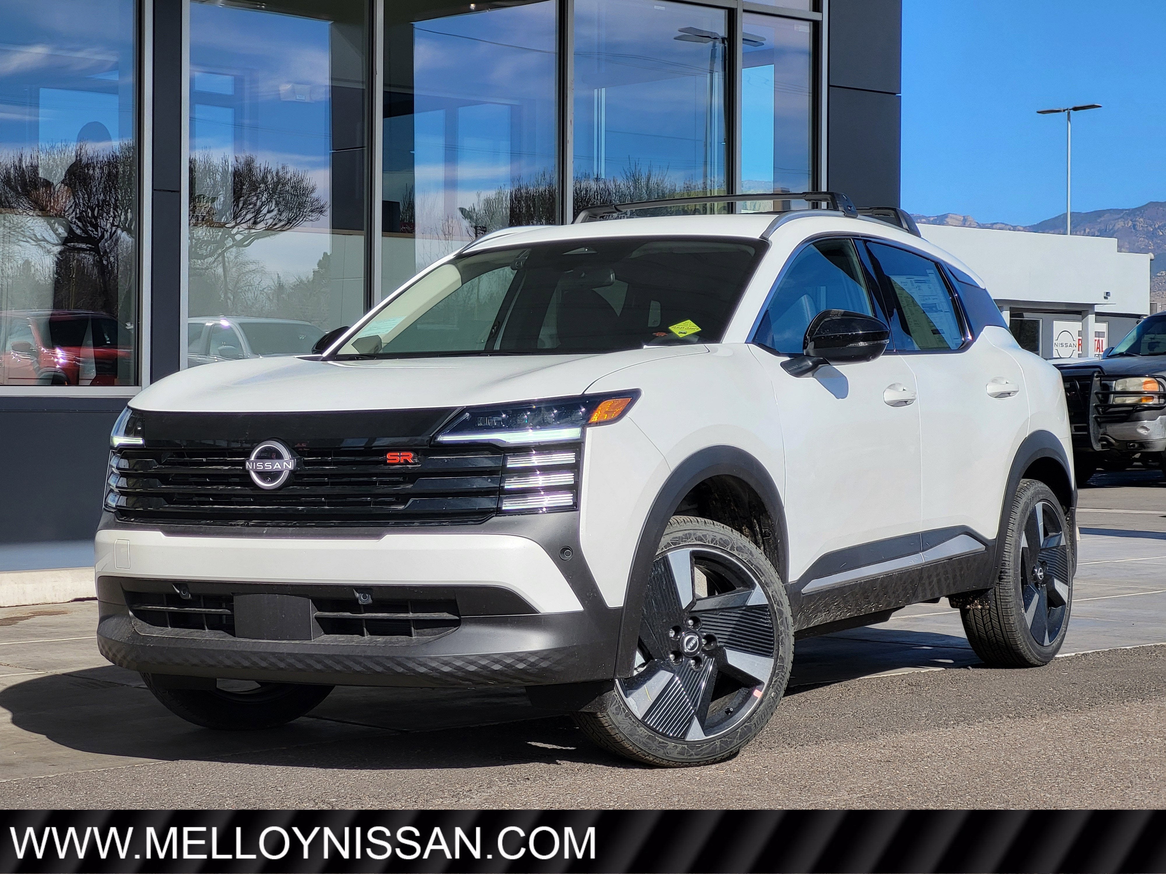 2026 Nissan Kicks SR AWD in Aspen White Tricoat — front three-quarter view