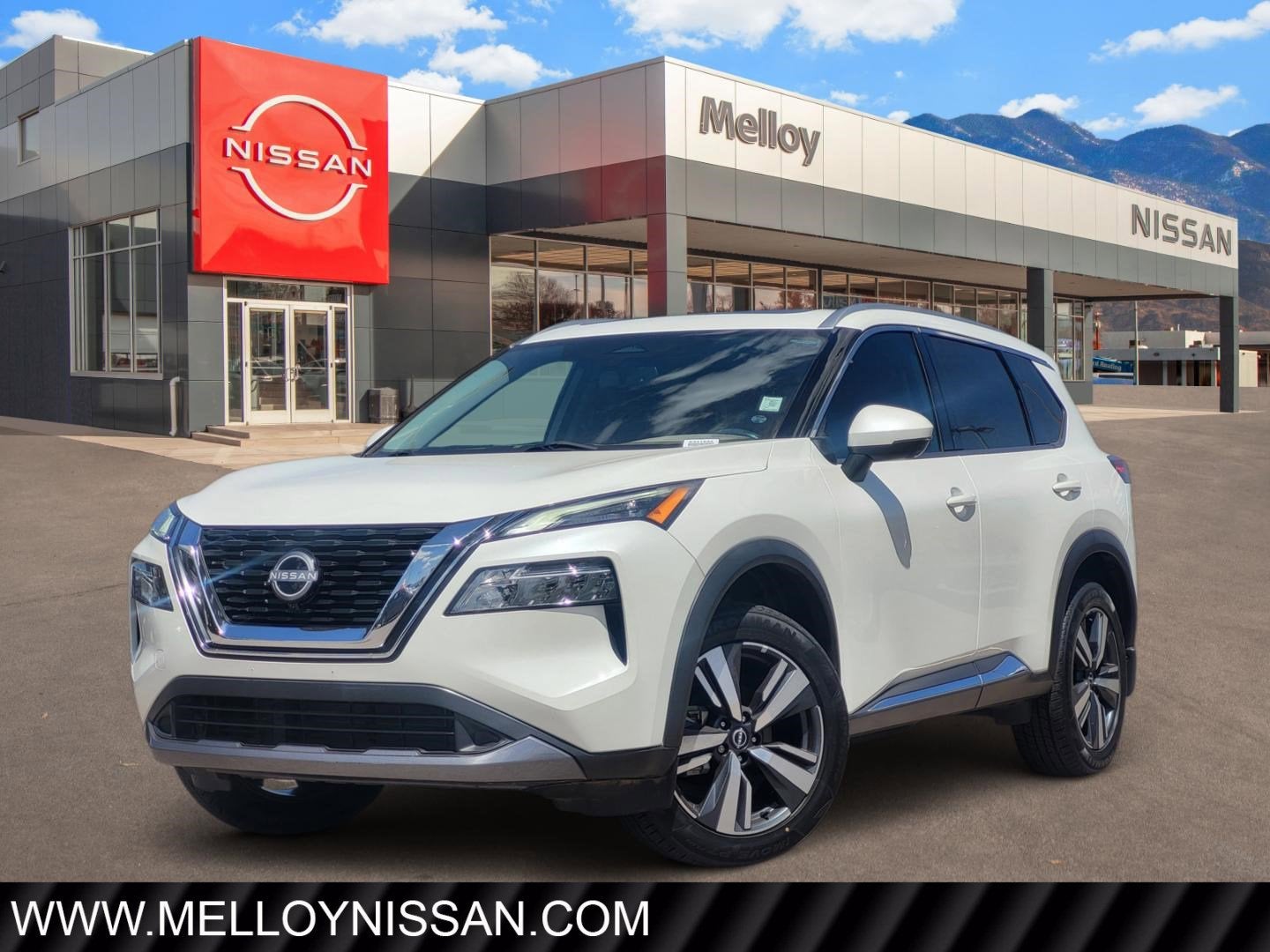2023 Nissan Rogue SL in Pearl White Tricoat — front three-quarter view