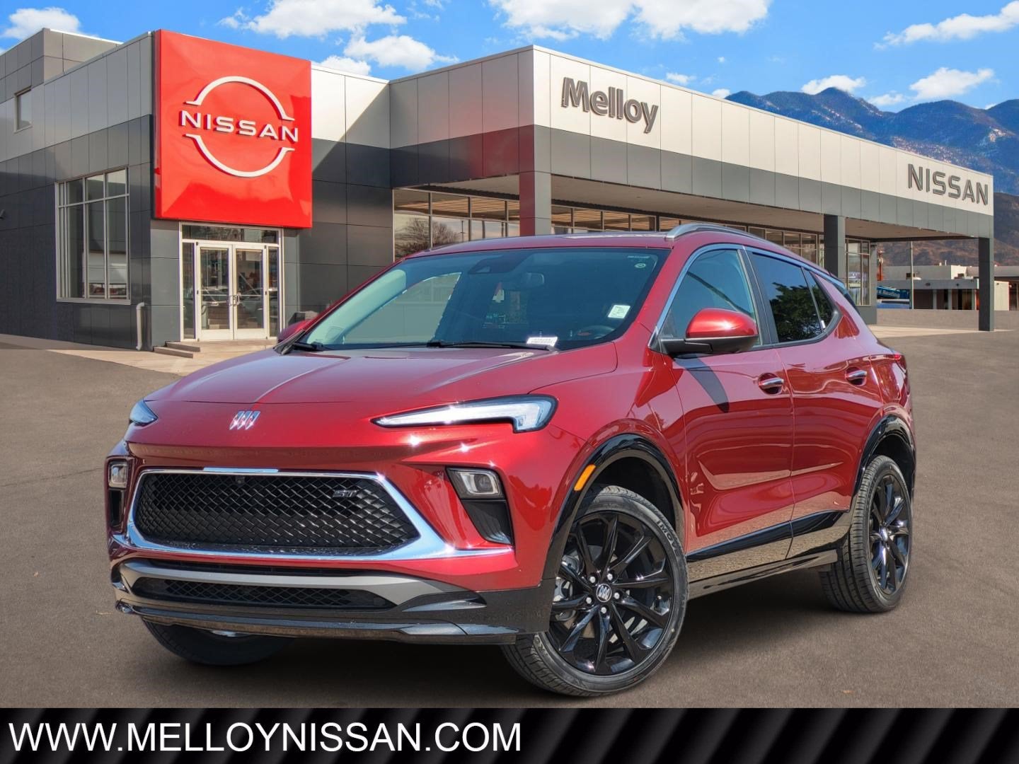 2024 Buick Encore GX Sport Touring in Cinnabar Metall — front three-quarter view